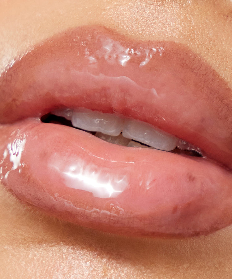 Model wears Lip Sculpt & Lip Gloss in Taupe