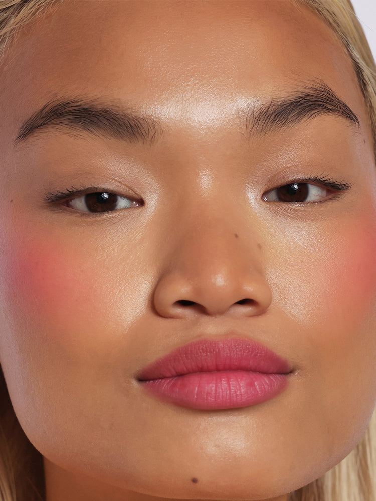 Ella wears Lip Blush in shade Guava